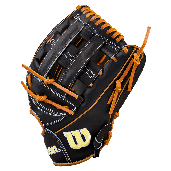 The Wilson A2000 1750 12.5" baseball glove (WBW104121125) features black and brown Pro Stock leather with tan laces, white stitching, and a yellow embroidered Wilson logo near the wrist, shown on a white background.