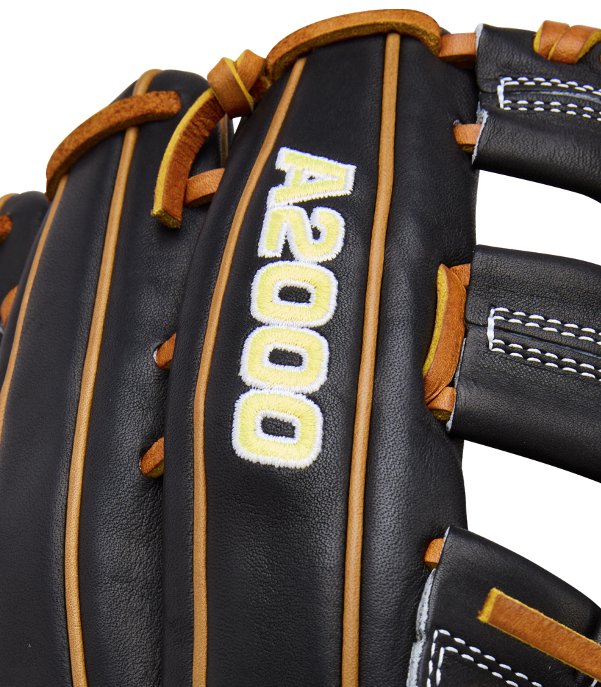 Close-up of the Wilson A2000 1750 12.5" Baseball Glove (WBW104121125), a black outfield glove with brown laces, white stitching, and "A2000" embroidered in white with yellow outlining, crafted from Pro Stock leather.