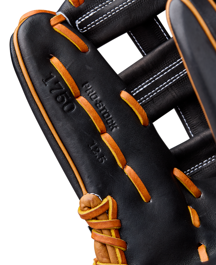 Close-up of the Wilson A2000 1750 12.5" Baseball Glove (WBW104121125), crafted from Pro Stock leather in black and brown, with detailed stitching, laces, and embossed A2000 markings from the Classics Series.