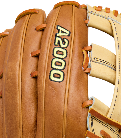 Close-up of a Wilson A2000 1777 12.75" Baseball Glove (WBW1041251275), featuring brown Pro Stock Leather, yellow and black A2000 stitching, plus tan and cream lacing and accents.