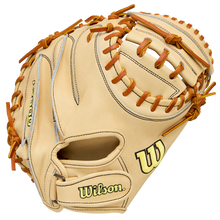 The Wilson A2000 PF33 33" catcher's mitt, crafted from Pro Stock Leather, features a tan design with brown laces, black stitching, and the Wilson logo in yellow and black on the thumb and wrist.