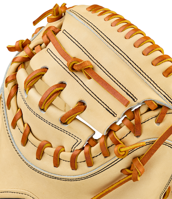 Close-up of the Wilson A2000 PF33 33" Baseball Catcher's Mitt (WBW10412733) in beige with brown laces, showcasing Pro Stock Leather webbing and detailed stitching.