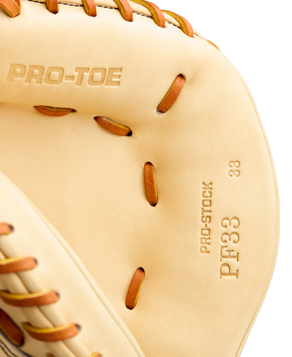 Close-up of a tan Wilson A2000 PF33 33" Baseball Catcher's Mitt (WBW10412733) with brown leather lacing, featuring PRO-TOE and PRO-STOCK PF33 33" stamped on the inside.