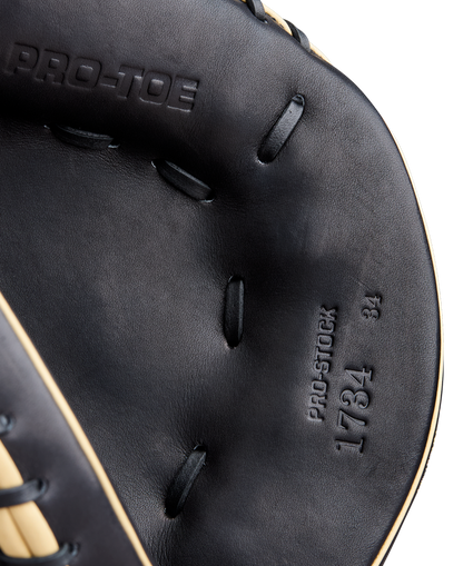 Close-up of the Wilson A2000 1734 34" Catcher's Mitt (WBW10412834) in black, showing detailed stitching and embossed text, highlighting Wilson’s authentic Pro Stock Leather craftsmanship.