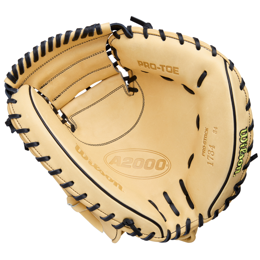 The Wilson A2000 1734 34" Baseball Catcher's Mitt (WBW10412934) features tan Pro Stock Leather, black lacing, PRO-TOE, and "1734" printed inside. Displayed open on a white background, it highlights detailed interior craftsmanship.