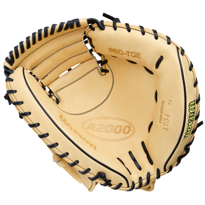 The Wilson A2000 1734 34" Baseball Catcher's Mitt (WBW10412934) features tan Pro Stock Leather, black lacing, PRO-TOE, and "1734" printed inside. Displayed open on a white background, it highlights detailed interior craftsmanship.