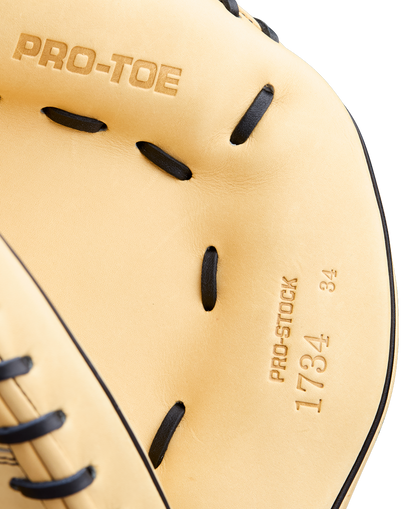 Close-up of a tan Wilson A2000 1734 34" Baseball Catcher's Mitt (WBW10412934) with black laces. "PRO-TOE," "Pro Stock Leather," and "1734 34" are embossed in the leather, showing off the interior and detailed stitching.