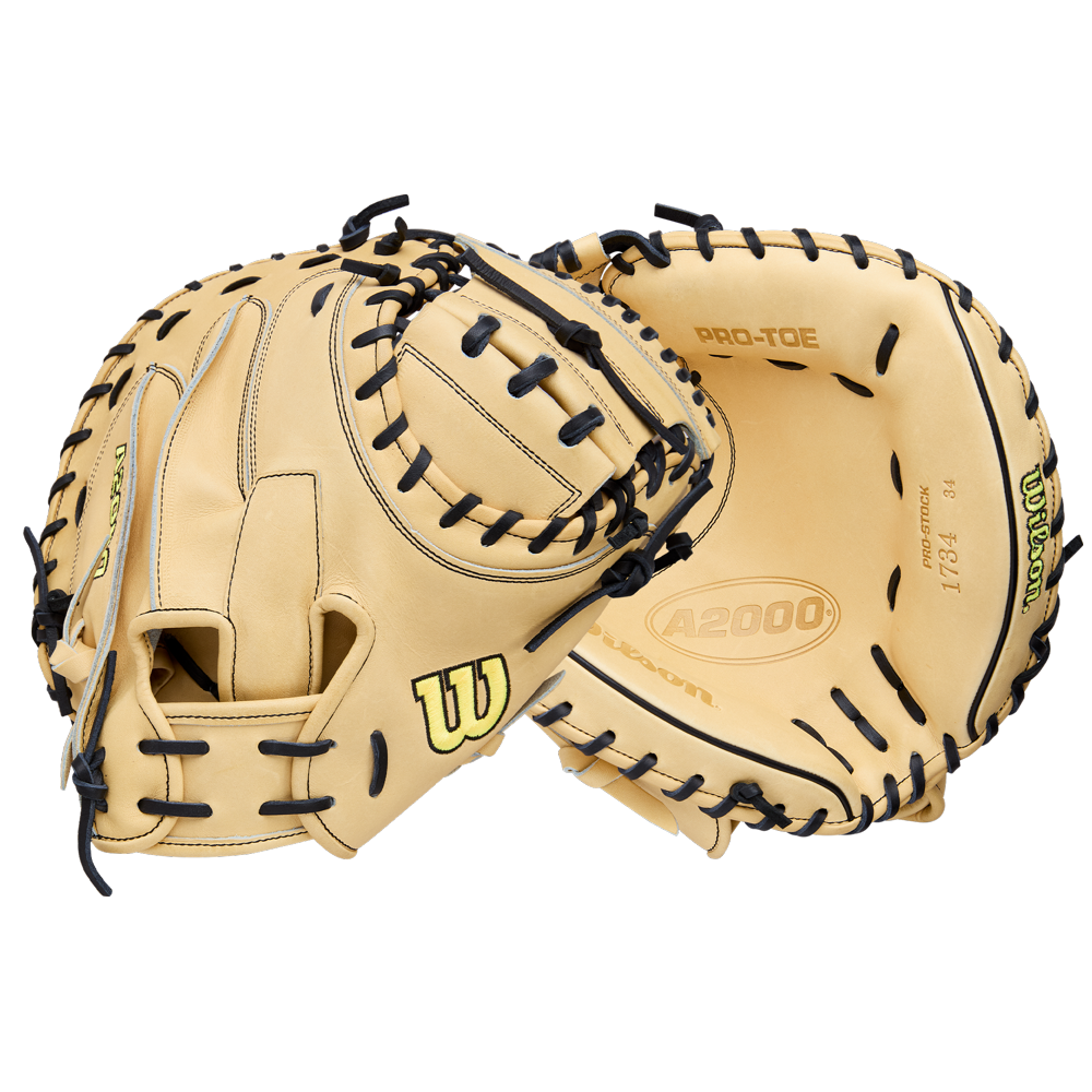 Two tan Wilson A2000 1734 34" Baseball Catcher's Mitts (WBW10412934) with black lacing, made from Pro Stock Leather, are shown—one open and one partially closed—against a plain white background. Brand: Wilson.