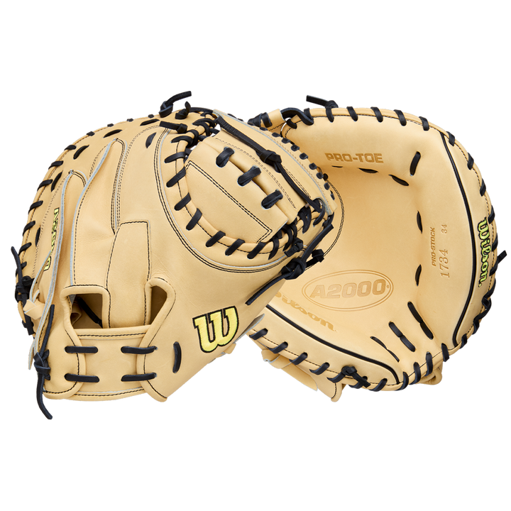 Two tan Wilson A2000 1734 34" Baseball Catcher's Mitts (WBW10412934) with black lacing, made from Pro Stock Leather, are shown—one open and one partially closed—against a plain white background. Brand: Wilson.
