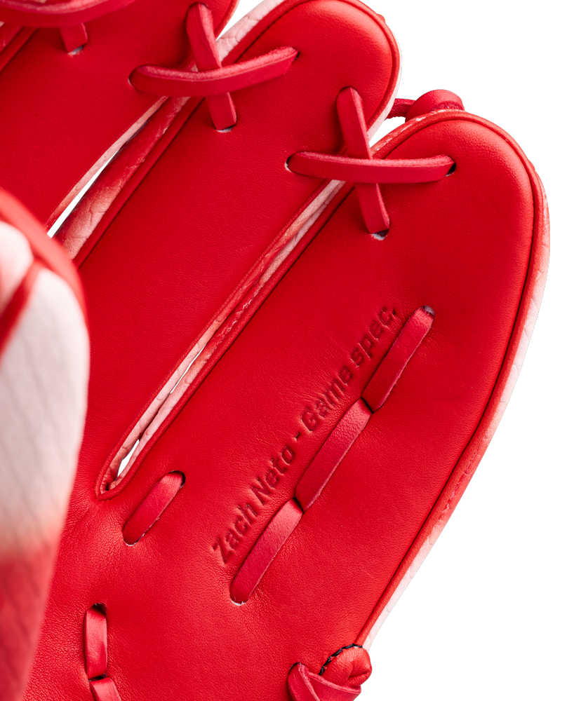 Close-up of a Wilson A2000 ZN9 11.75" Zach Neto GM Baseball Glove (WBW1041341175) in red, featuring detailed stitching and “Zach Neto Game Spec” embossed on the leather—a premium infield glove built for performance.