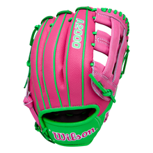 The Wilson A2000 JR11 12" José Ramírez GM Baseball Glove (WBW10413512) is a pink Wilson infield glove with green laces and trim, white stitching, SuperSkin technology, and green and pink Wilson logo on the wrist strap.