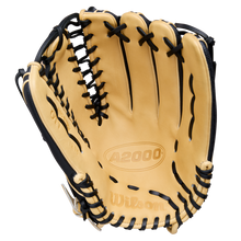 A Wilson A2000 OT7SS 12.75" Baseball Glove (WBW1041831275) in tan leather with black laces is shown open, palm up, highlighting the Wilson brand and model embossed inside.