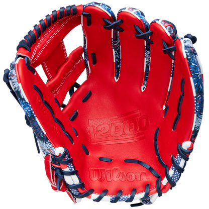 The Wilson A2000 1975SS 11.75" Baseball Glove (GOTM July 2025, WBW1042171175) features a red design with dark blue and white laces, blue and white accents, Pro Stock leather, and the A2000 logo embossed on the palm.
