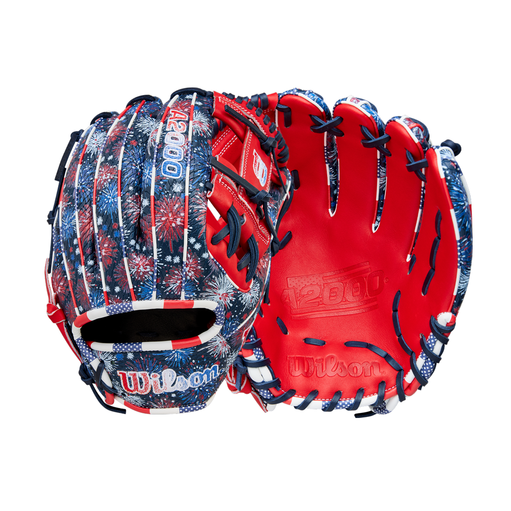 Two Wilson A2000 1975SS 11.75" Baseball Gloves (GOTM July 2025) with a red, white, and blue fireworks design and bright red Pro Stock leather lining are displayed against a white background.