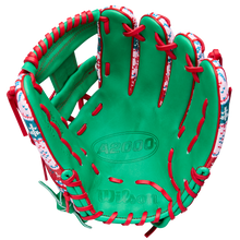 The Wilson A2000 1975 11.75" Baseball Glove - GOTM December 2025 features green Pro Stock leather, red laces, and a festive snowflake and holiday pattern along the edges for a unique holiday design.