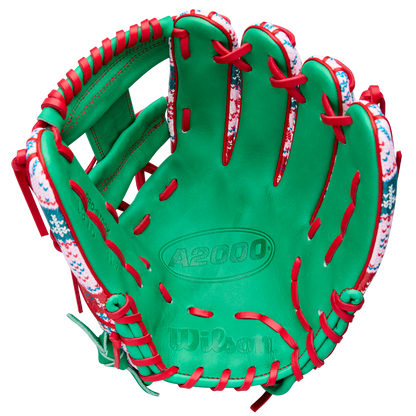 The Wilson A2000 1975 11.75" Baseball Glove - GOTM December 2025 features green Pro Stock leather, red laces, and a festive snowflake and holiday pattern along the edges for a unique holiday design.