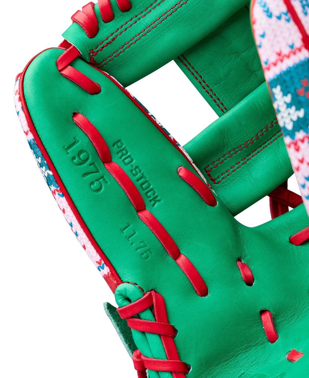 A close-up of the Wilson A2000 1975 11.75" Baseball Glove (GOTM December 2025) shows its green Pro Stock leather, red laces, and festive trim, with "PRO STOCK," "1975," and "11.75" stamped on the glove.