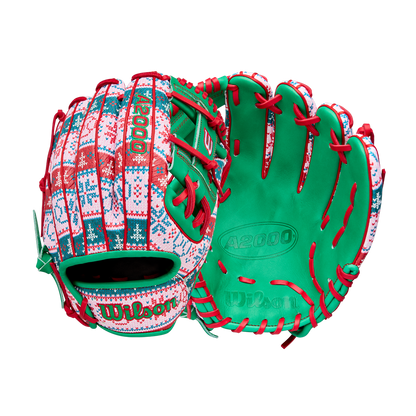 The Wilson A2000 1975 11.75" Baseball Glove (GOTM December 2025: WBW1042211175) features a festive holiday sweater design with red, green, and white patterns, green palms, and red laces.
