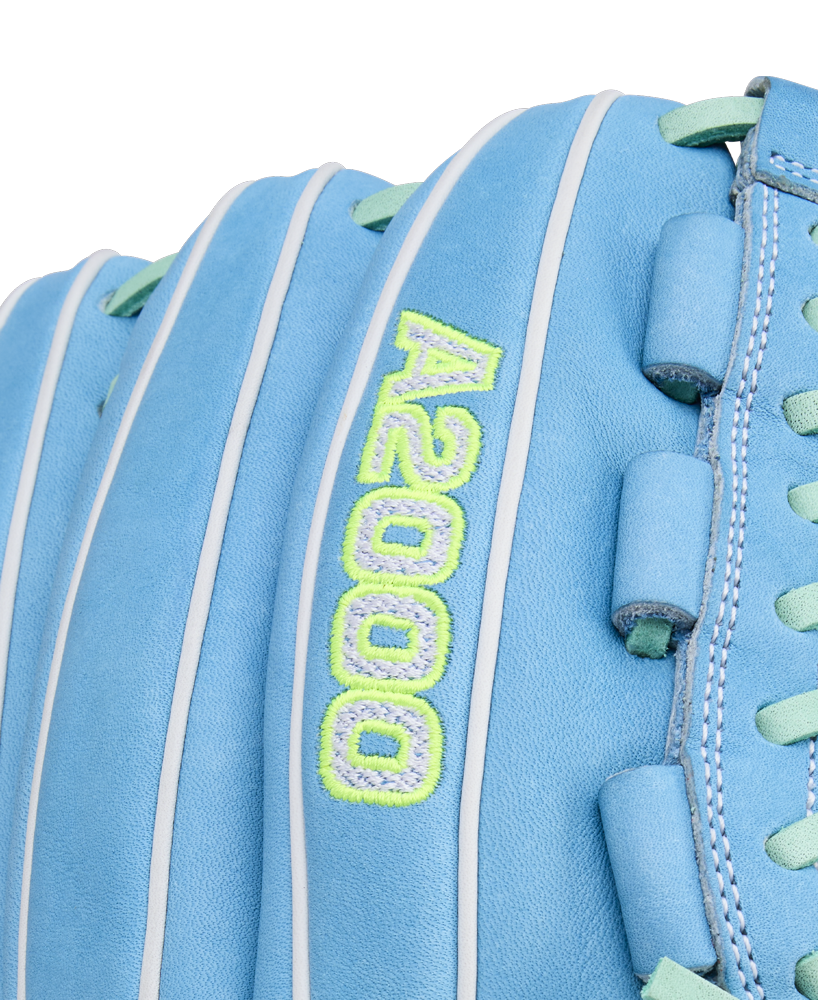 Close-up of a Wilson A2000 FPHG 12" Fastpitch Glove (WBW10423512) in light blue leather with white piping, mint green and yellow A2000 embroidery, plus blue lace detailing.