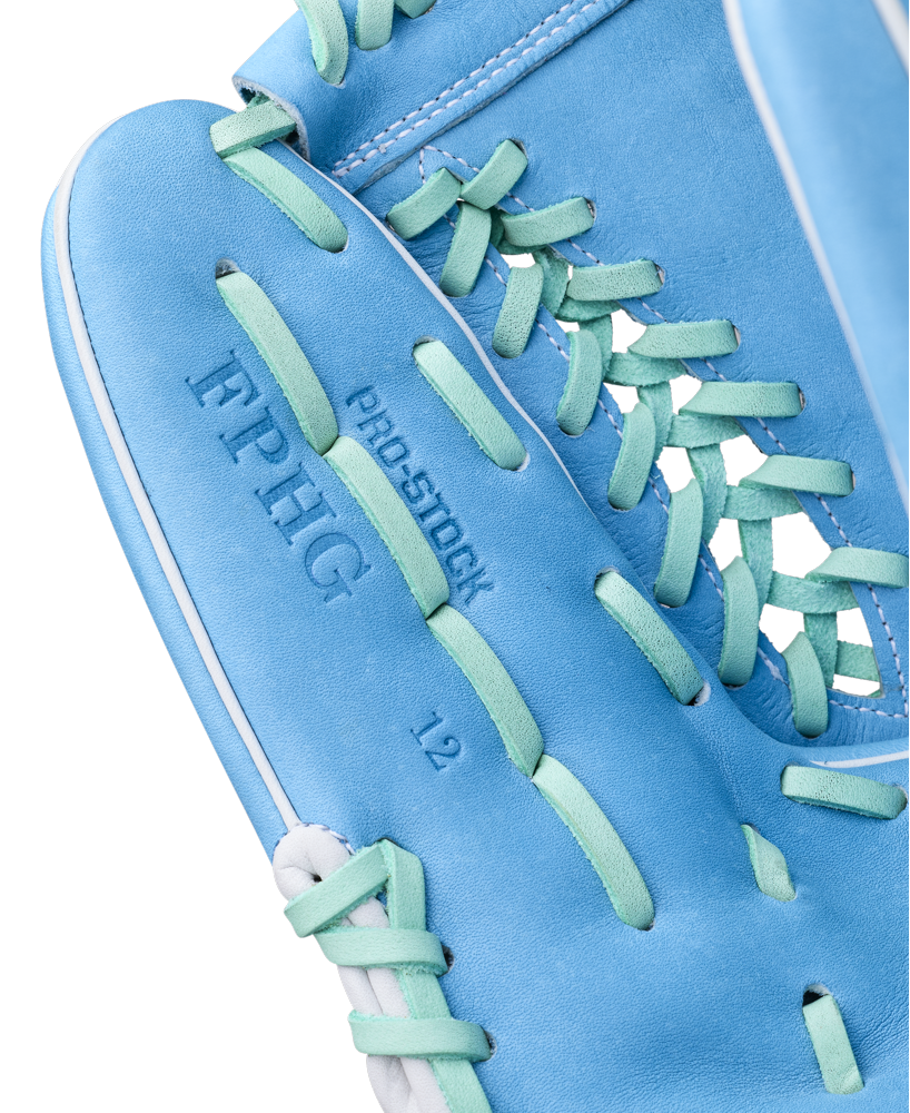 Close-up of the Wilson A2000 FPHG 12" Fastpitch Glove (WBW10423512) in bright blue with teal laces, crafted from Pro Stock leather and featuring embossed text: PRO STOCK, EPHG, and 12 on the palm.