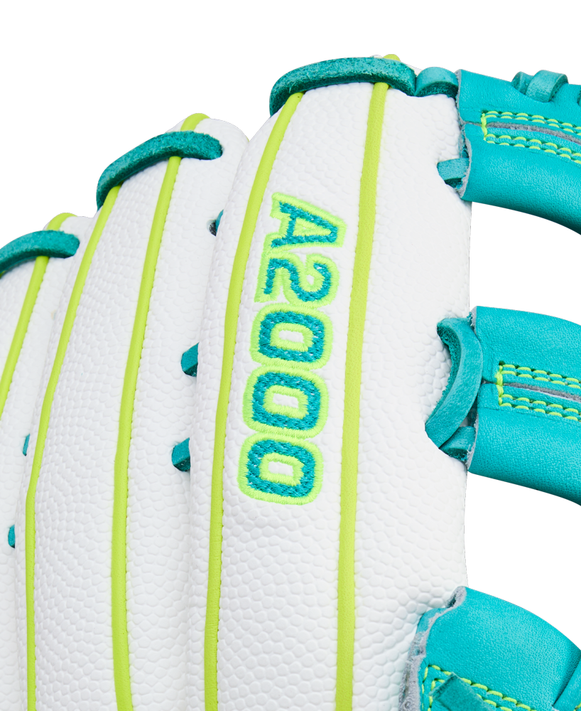 Close-up of the Wilson A2000 FP50SS 12.25" Fastpitch Glove by Wilson, a white outfield glove with teal and neon yellow stitching, SuperSkin and Pro Stock leather, and "A2000" embroidered in bright green on the back.