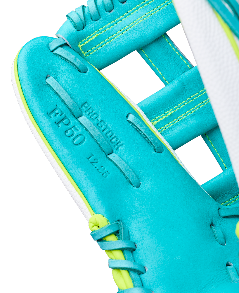 Close-up of a Wilson A2000 FP50SS 12.25" Fastpitch Glove (WBW1042371225) in teal and yellow, showcasing the palm area with "PRO STOCK," "IFP50," and "12.25" stamped on the Pro Stock leather near the stitched webbing.