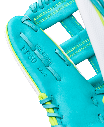 Close-up of a Wilson A2000 FP50SS 12.25" Fastpitch Glove (WBW1042371225) in teal and yellow, showcasing the palm area with "PRO STOCK," "IFP50," and "12.25" stamped on the Pro Stock leather near the stitched webbing.