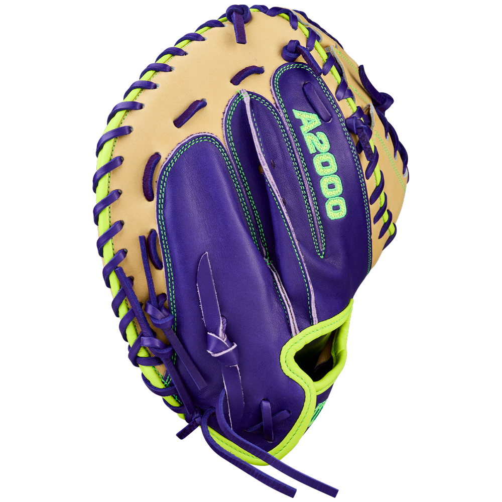 The Wilson A2000 FPCM23 34" Fastpitch Catcher's Mitt (WBW10423934) features Pro Stock leather, tan and bold purple sections, neon green lacing and accents, and "A2000" stitched in green on the palm.