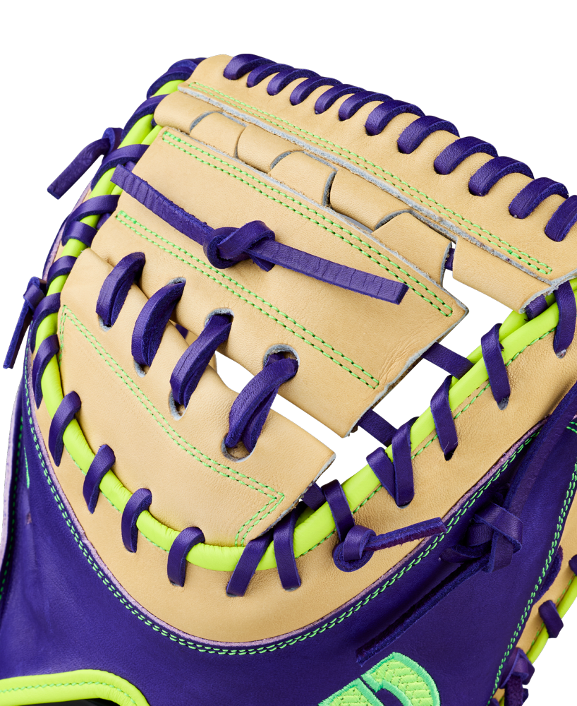 Close-up of the Wilson A2000 FPCM23 34" Fastpitch Catcher's Mitt, crafted with tan Pro Stock leather and accented by bright purple and neon green laces for a vibrant, eye-catching design.