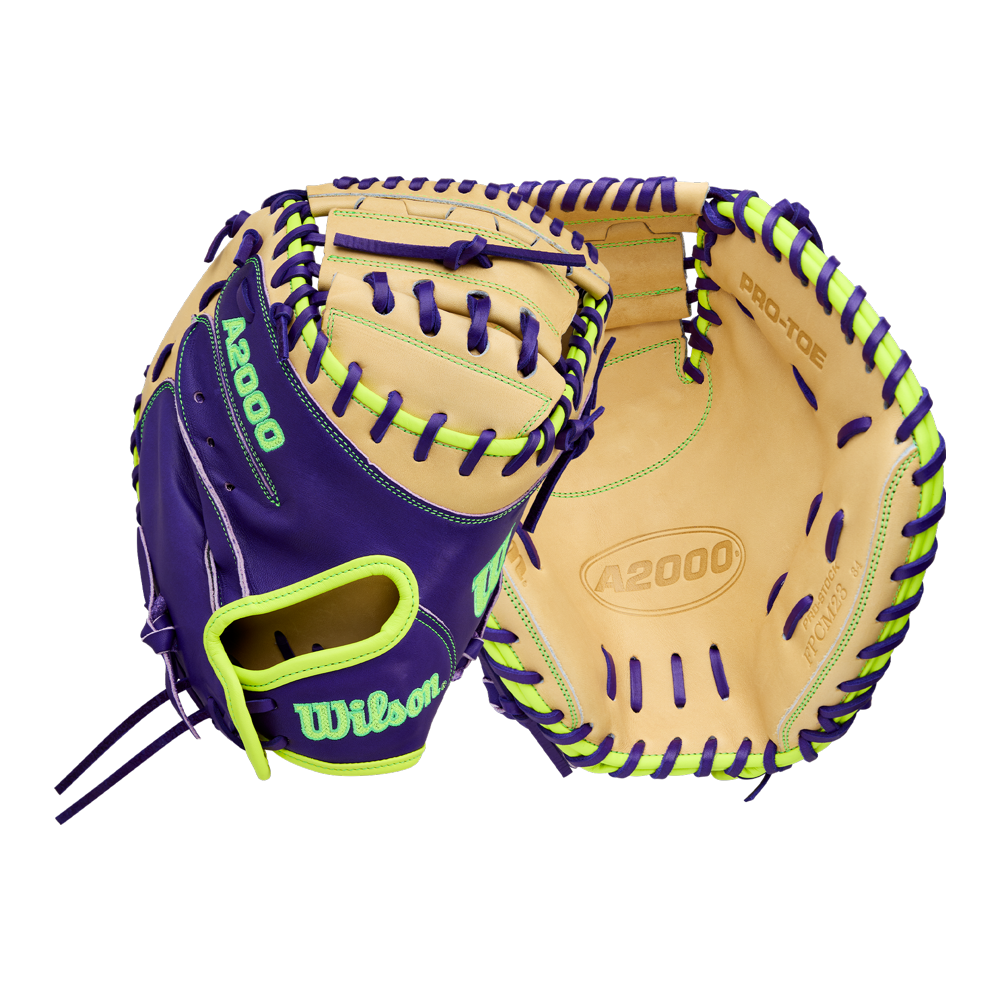 A Wilson A2000 FPCM23 34" Fastpitch Catcher's Mitt (WBW10423934) in purple and tan Pro Stock leather with neon green accents is shown, displaying both palm and back sides on a plain white background.
