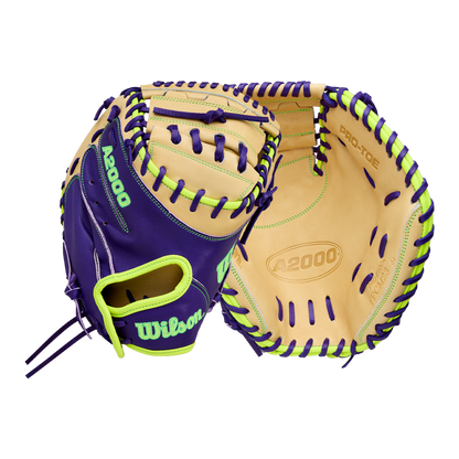 A Wilson A2000 FPCM23 34" Fastpitch Catcher's Mitt (WBW10423934) in purple and tan Pro Stock leather with neon green accents is shown, displaying both palm and back sides on a plain white background.