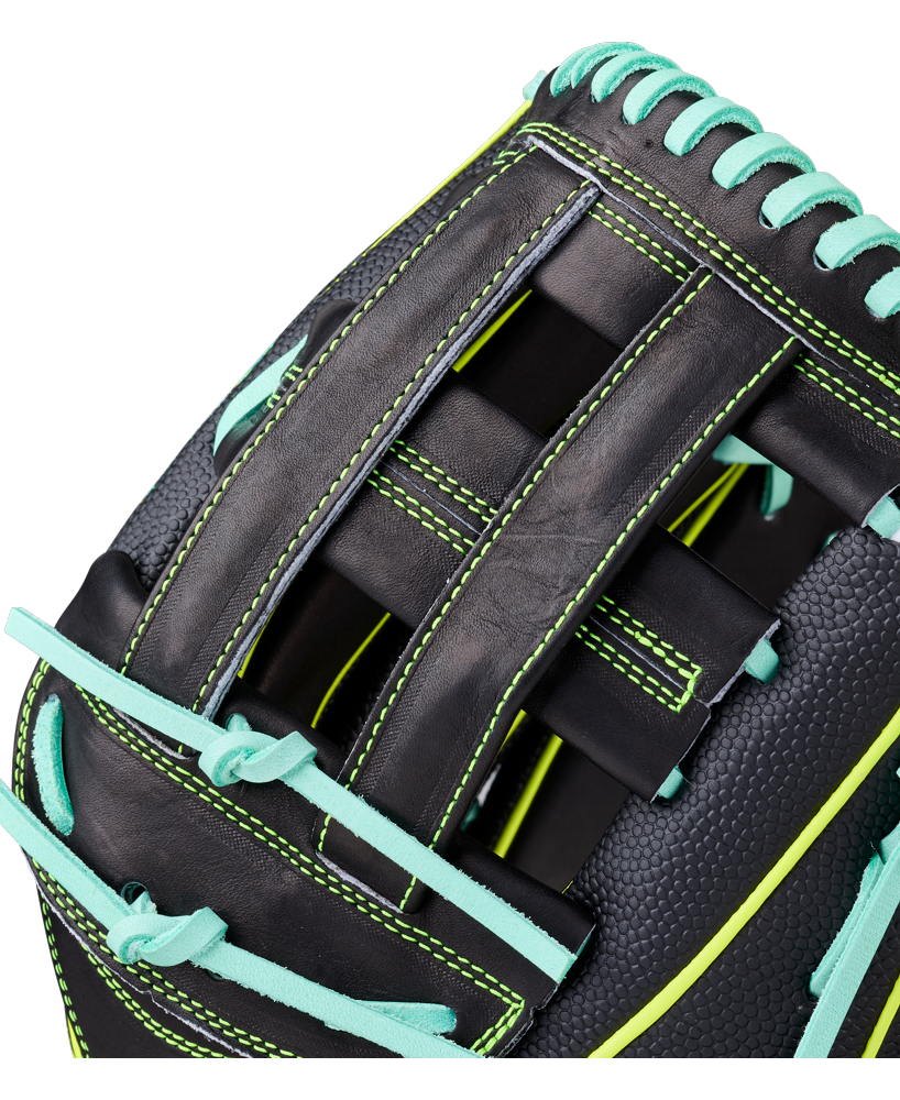 Close-up of a Wilson A2000 1750SS 12.5" Baseball Glove (WBW104599125) crafted with Pro Stock leather, featuring bright teal laces, neon green stitching, a detailed woven web, and a textured black leather finish.