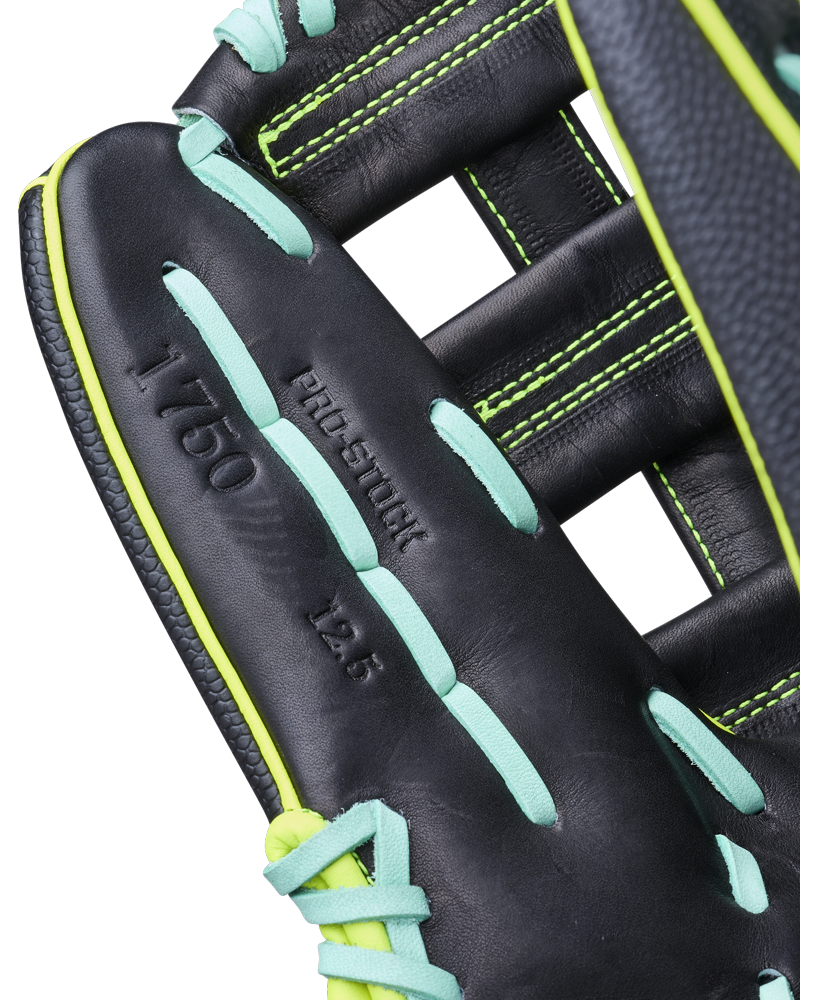 Close-up of the Wilson A2000 1750SS 12.5" Baseball Glove (WBW104599125) with bright green and teal laces, featuring PRO-STOCK 12.5 1750 embossing and detailed stitching on premium Pro Stock leather.