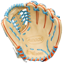 The Wilson A2000 PF89 11.5" Baseball Glove (WBW104602115) features a cream color with blue and orange laces, Pro Stock leather, Pedroia Fit design, and the Wilson logo embossed on the palm. Palm and finger slots are visible when open.