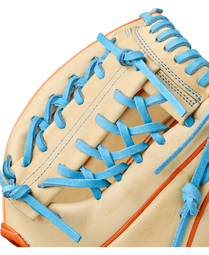 A close-up of the Wilson A2000 PF89 11.5" Baseball Glove (WBW104602115) by Wilson featuring tan Pro Stock leather, bright blue laces, orange trim, detailed stitching, and a woven pocket design.
