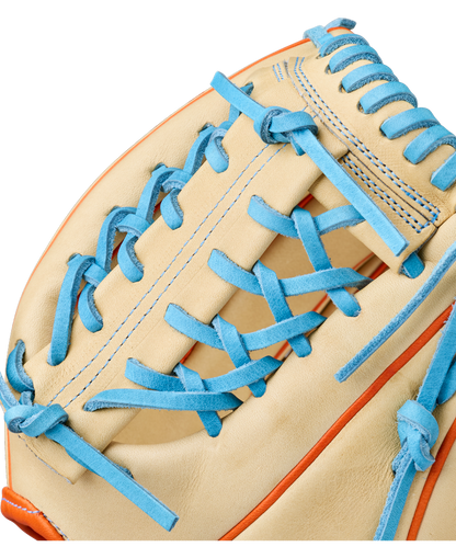 A close-up of the Wilson A2000 PF89 11.5" Baseball Glove (WBW104602115) by Wilson featuring tan Pro Stock leather, bright blue laces, orange trim, detailed stitching, and a woven pocket design.