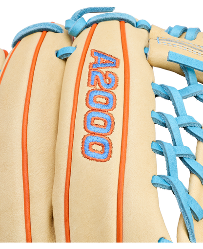 Close-up of a tan Wilson A2000 PF89 11.5" baseball glove with blue laces, orange stitching, and "A2000" embroidered in blue with an orange outline on the back. Brand: Wilson. Model: WBW104602115.