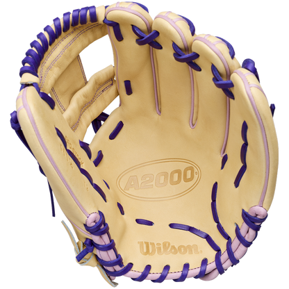 A tan Wilson A2000 H12 12" Fastpitch Glove (WBW10460712) with purple laces, made from Pro Stock Leather, is displayed open showing Wilson branding on the palm and inner wrist.