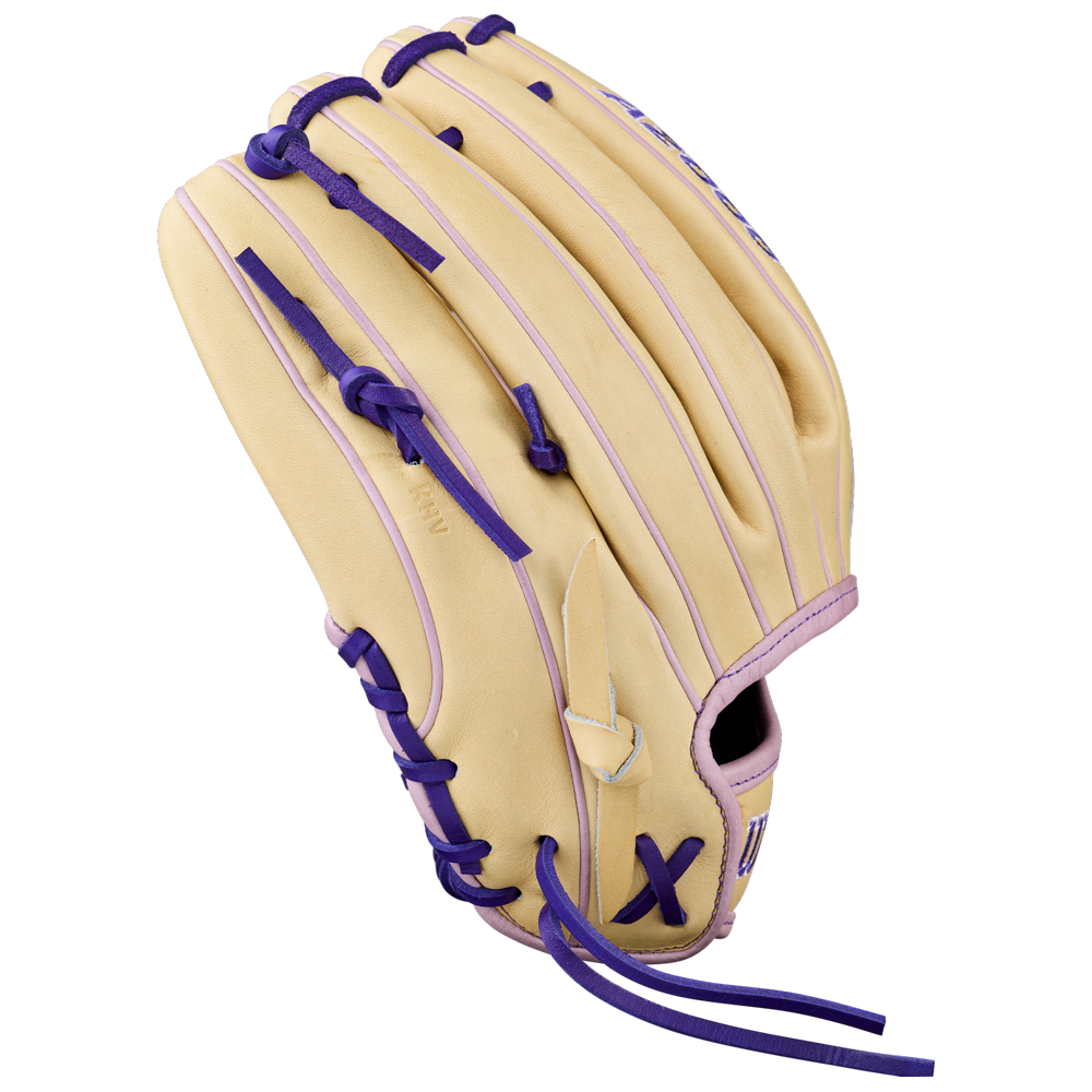 The Wilson A2000 H12 12" Fastpitch Glove: WBW10460712, in tan with purple laces and accents, made from Pro Stock Leather, is displayed on a plain white background with a view from the back and side.