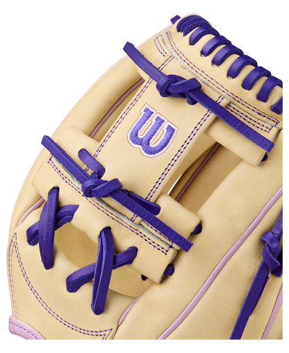 Close-up of the Wilson A2000 H12 12" Fastpitch Glove (WBW10460712) in beige, with purple laces and stitching, made from Pro Stock Leather and featuring the Wilson W logo in purple and white.