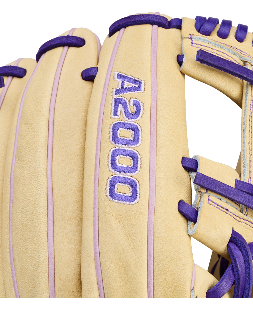 Close-up of a tan Wilson A2000 H12 12" Fastpitch Glove (WBW10460712) with purple laces and stitching, made from premium Pro Stock Leather. Features embroidered "A2000" in purple and white.