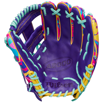 The Wilson A2000 1786SS 11.5" Baseball Glove GOTM January 2026 features Pro Stock leather in purple, aqua blue laces, yellow accents, and vibrant pink and yellow patterns on the inner sides.