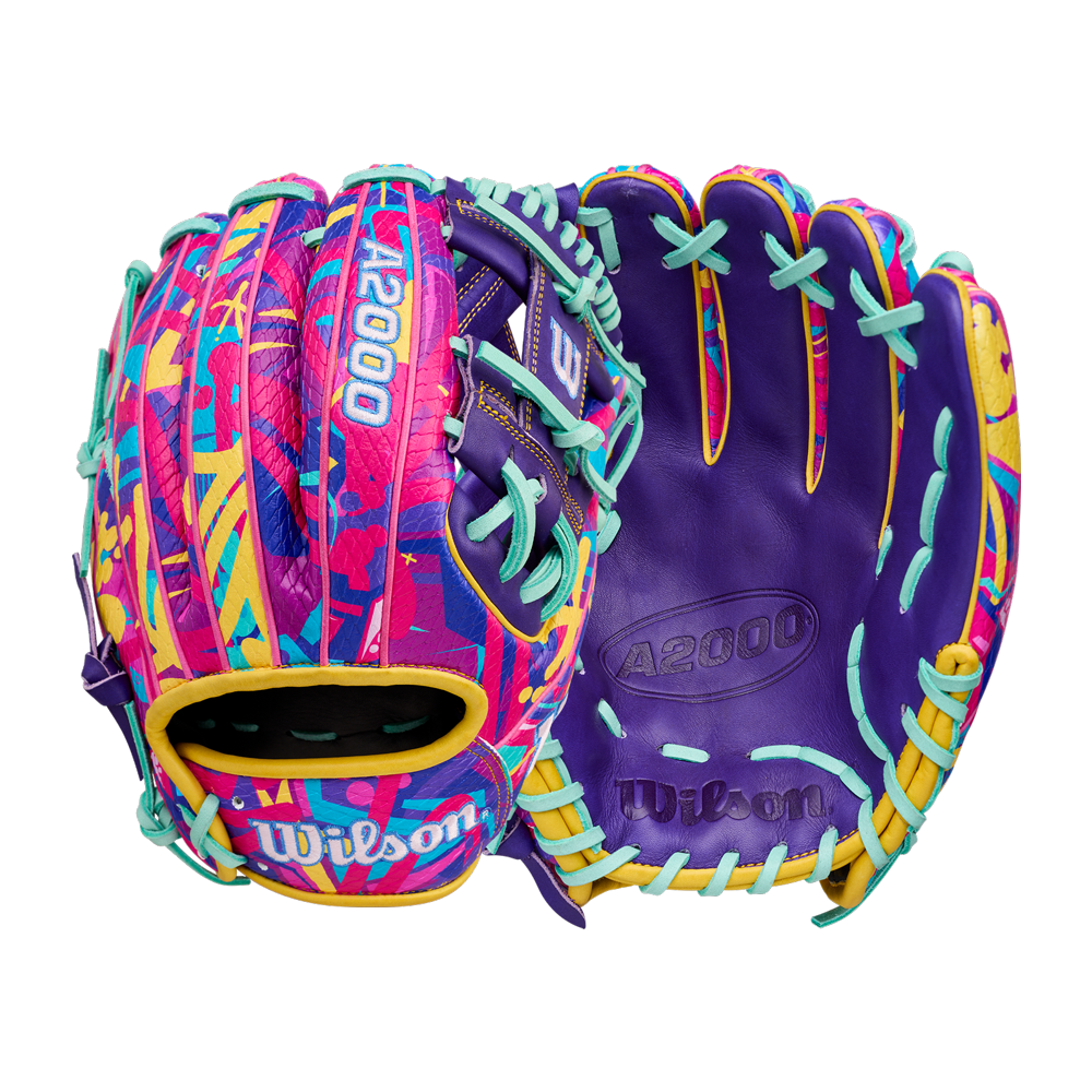 The Wilson A2000 1786SS 11.5" Baseball Glove - GOTM January 2026 (WBW104643115) features bold purple, pink, yellow, and blue accents with abstract patterns, turquoise laces, Pro Stock leather construction, and Wilson branding.