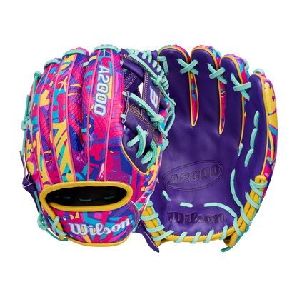 The Wilson A2000 1786SS 11.5" Baseball Glove - GOTM January 2026 (WBW104643115) features bold purple, pink, yellow, and blue accents with abstract patterns, turquoise laces, Pro Stock leather construction, and Wilson branding.