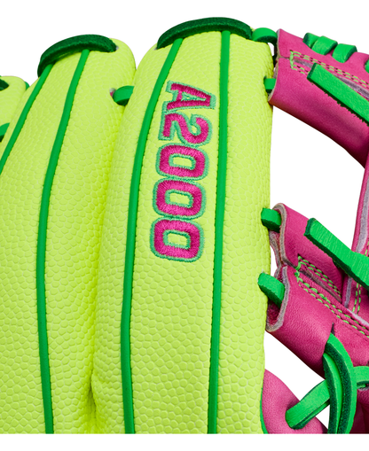 A close-up of the Wilson A2000 1975SS 11.75" Baseball Glove (GOTM March 2026) in neon yellow-green with pink and green accents, featuring embroidered A2000 text—showcasing its unique Wilson Glove of the Month design.