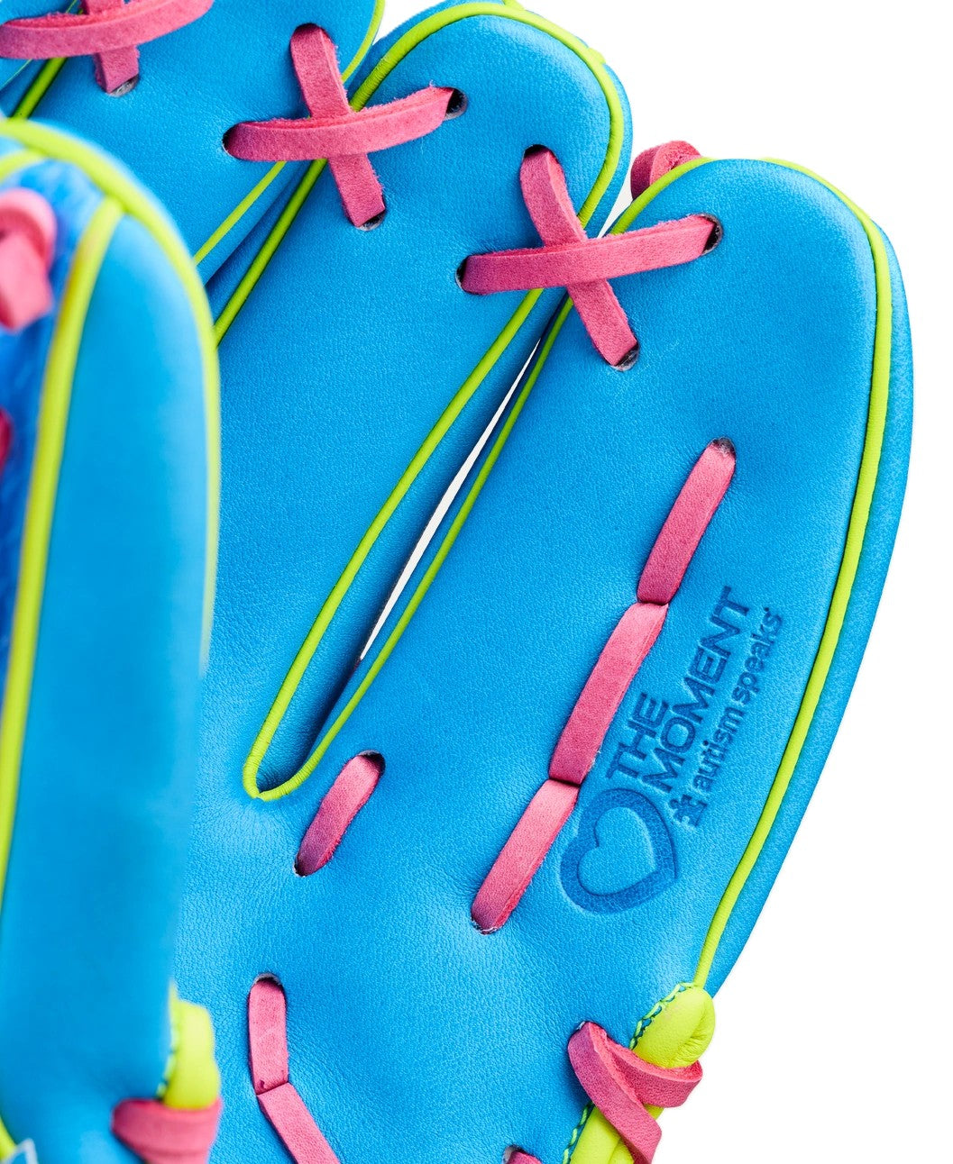 Close-up of the Wilson Love the Moment A2000 DP15 11.5" baseball glove, featuring Pro Stock leather in blue with pink laces, yellow trim, an embossed heart, and “The Moment” with “Autism Speaks” below.