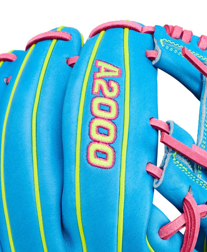 Close-up of a Wilson Love the Moment A2000 DP15 11.5" baseball glove in bright blue Pro Stock leather, with yellow-green accents, pink laces, and "A2000" embroidered in pink and yellow stitching.