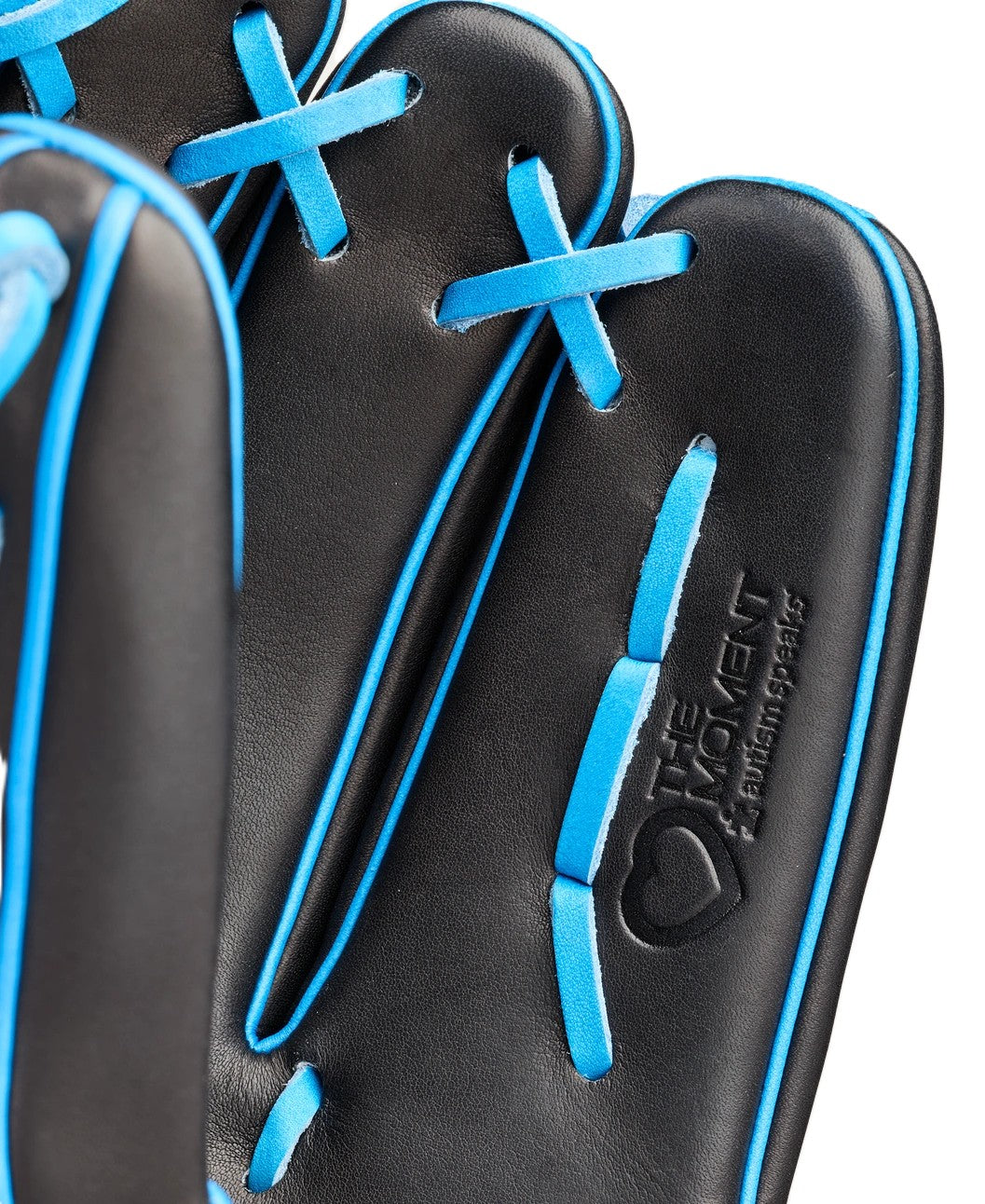 Close-up of the Wilson Love the Moment A2000 B23 12" Baseball Glove (WBW10482912) in black with bright blue laces, embossed text, and a heart logo reading "THE MOMENT & EVERYTHING BEHIND IT." Made from Pro Stock Leather.