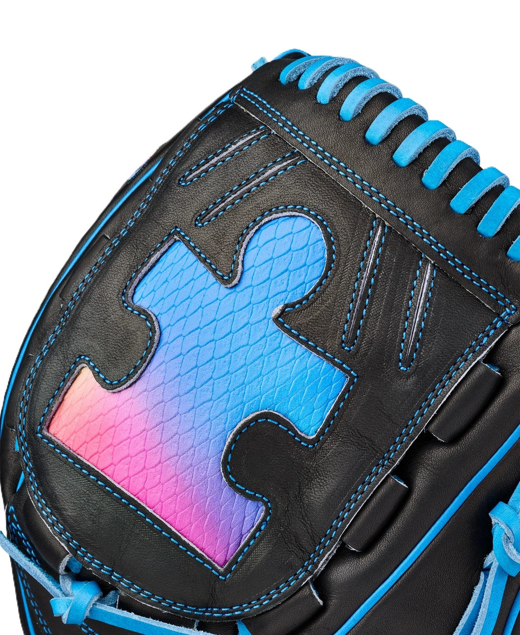 A close-up of the Wilson Love the Moment A2000 B23 12" Baseball Glove, crafted in black Pro Stock Leather with blue stitching and a blue-pink gradient puzzle piece design with snakeskin texture—an Autism Speaks edition.