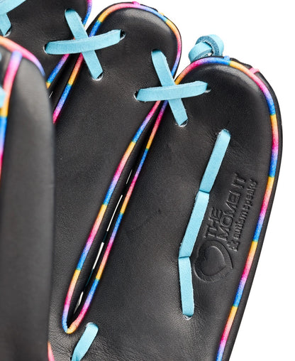 Close-up of a black leather Wilson Love the Moment A2000 1750 12.5" Baseball Glove with colorful rainbow-edged seams, light blue laces, and embossed with THE MOMENT and AMERICAN KIPSKIN near the palm.
